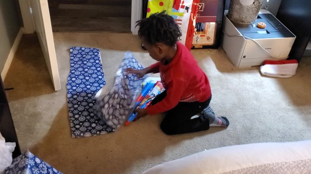 Miracle Baby Josiah Struggling to wrap his Christmas presents