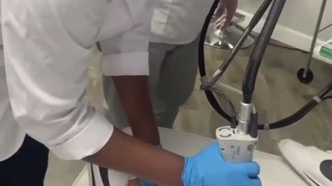 ⁣Performing a laser hair removal treatment