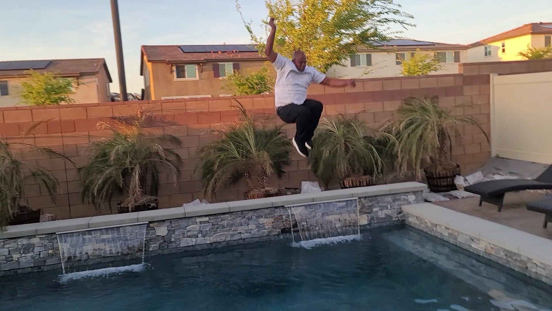 ⁣Russell Wilson Jumps from 20 feet high into Swimming Pool