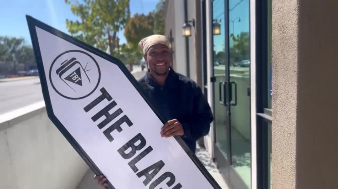 ⁣Viral Sign Spinner Rico pulls up to TBT Studios