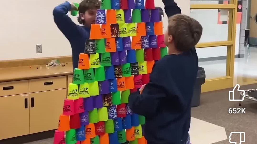 ⁣Sixth grade stacking a cup tower inside their classroom