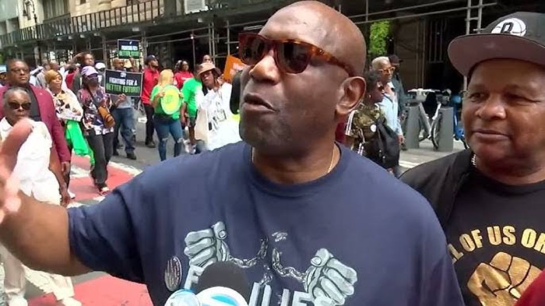 ⁣Thousands march on Wall Street to demand economic reforms and equity